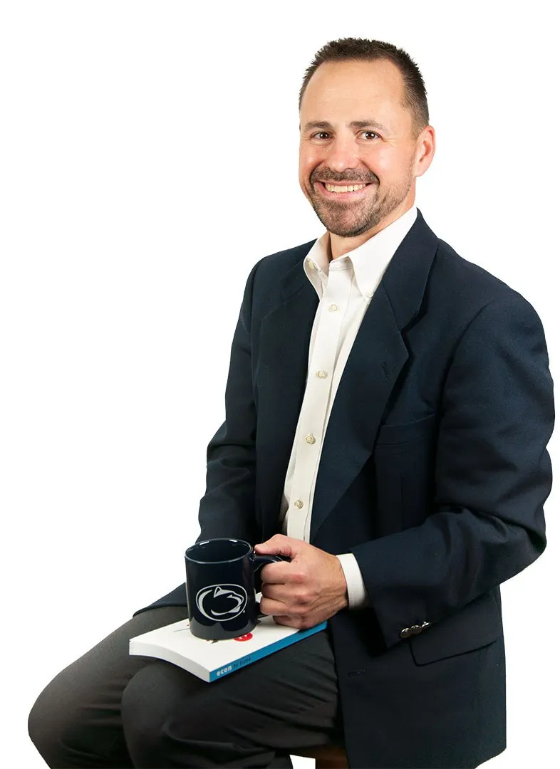Dr. Frank M. Sorokach seated, holding a tablet